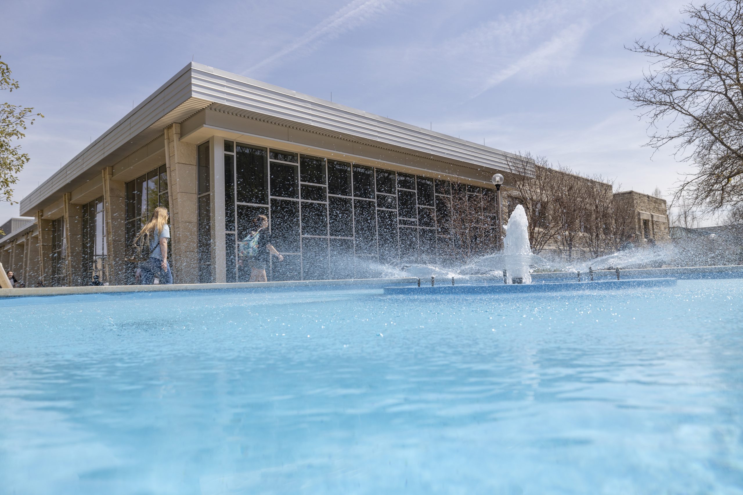 Students walk past the fountain near the Student Center